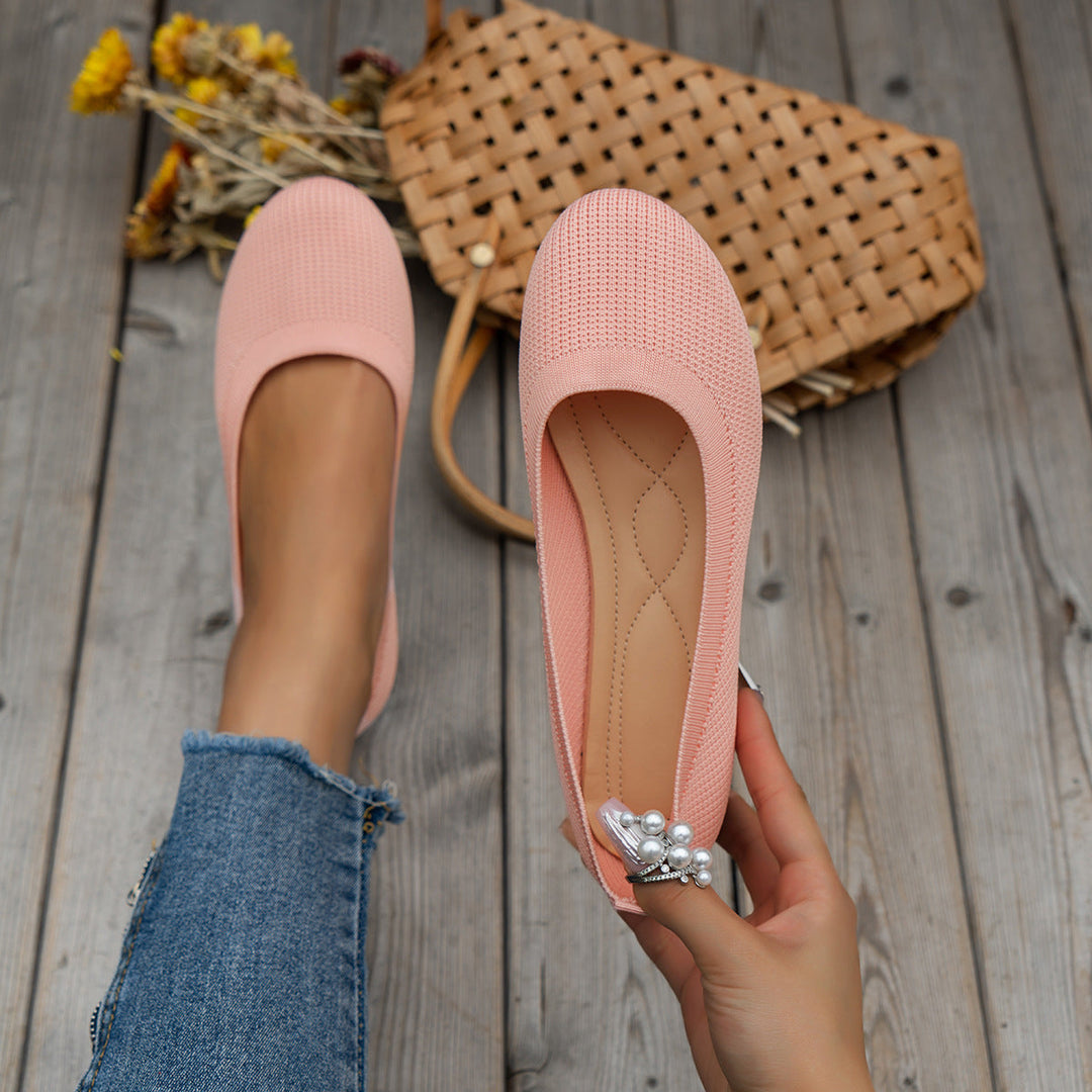 Woman walking in supportive orthopedic comfort flats, elegant ballerinas for everyday style.