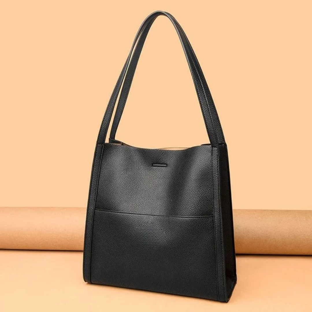 Stylish brown leather women's shoulder bag, large capacity for daily essentials.