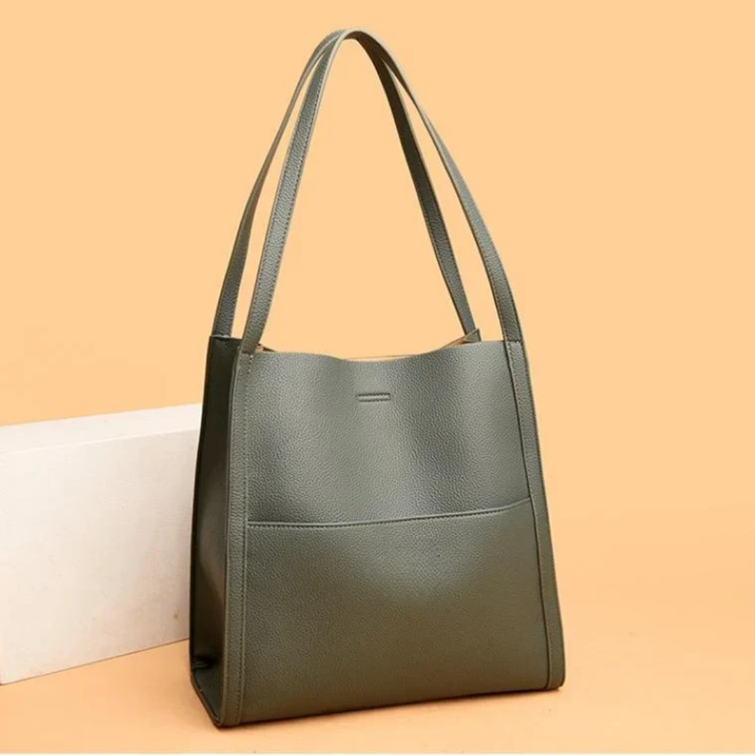 Spacious black leather tote bag for women, durable and perfect for everyday use.