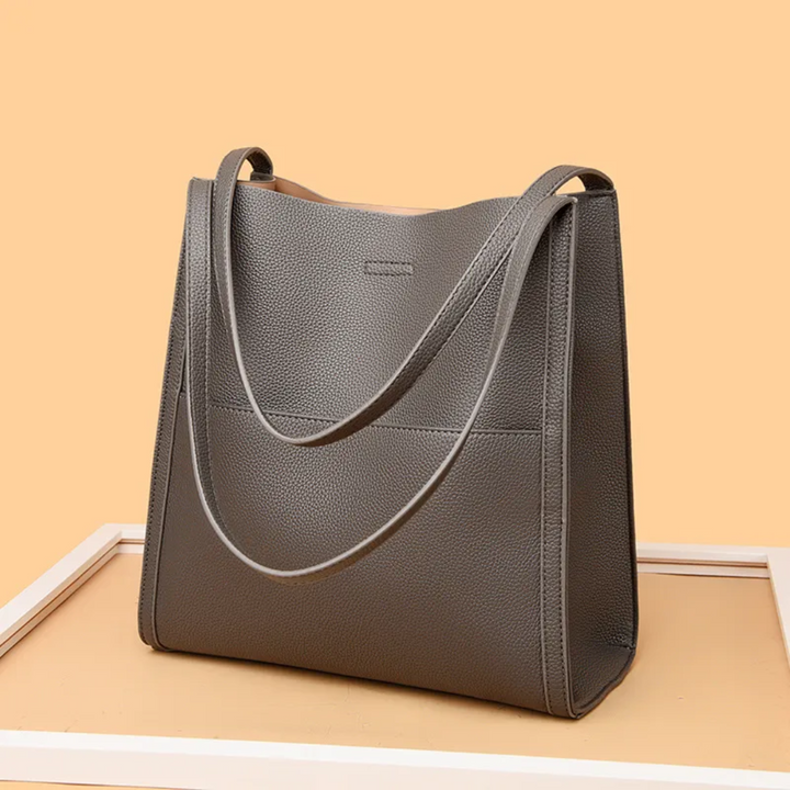 Gray women's leather everyday bag, spacious tote design for daily use & essentials.