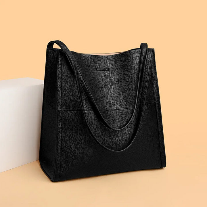 Chic black leather women's handbag, a spacious and versatile everyday tote bag.