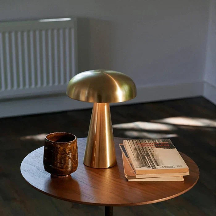 Chic bronze ShroomLite portable LED mushroom lamp. Rechargeable wireless light for modern home decor.