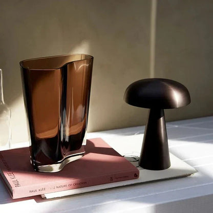Versatile portable LED mushroom lamp, wireless & rechargeable. Perfect for ambient or desk lighting. Gold.