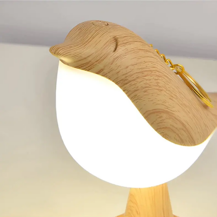 Elegant LED bird light with intuitive touch control and an integrated aroma diffuser.
