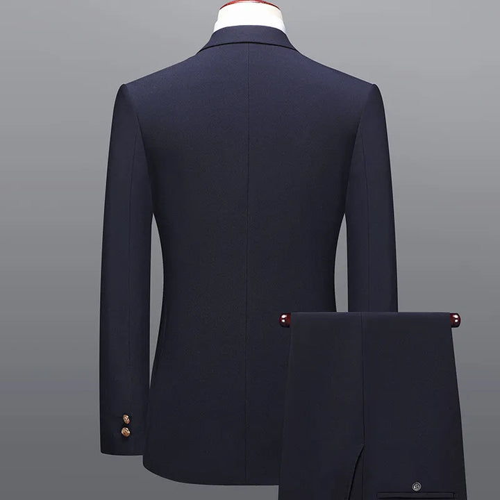 Tailored men's dark blue double-breasted two-piece suit. Timeless formal attire for weddings & professional events.