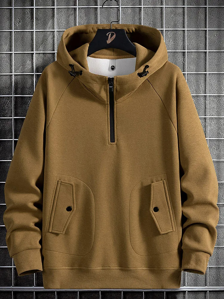 Stylish men's quarter-zip hoodie for versatile layering, offering comfort and utility for casual everyday wear.