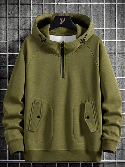 Green men's relaxed fit quarter-zip hoodie, ideal for comfortable layering and stylish casual outerwear.