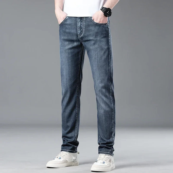 Fashionable men's straight fit jeans in a classic blue wash, enhancing any casual outfit.