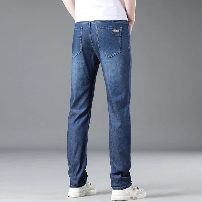 Effortless men's straight fit blue jeans, offering timeless style & comfortable denim for daily wear.