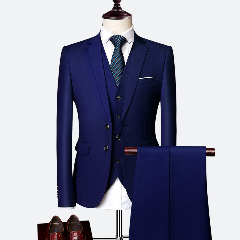 Stylish men's three-piece tailored suit in charcoal grey, perfect formal wear for weddings, business events & special occasions.