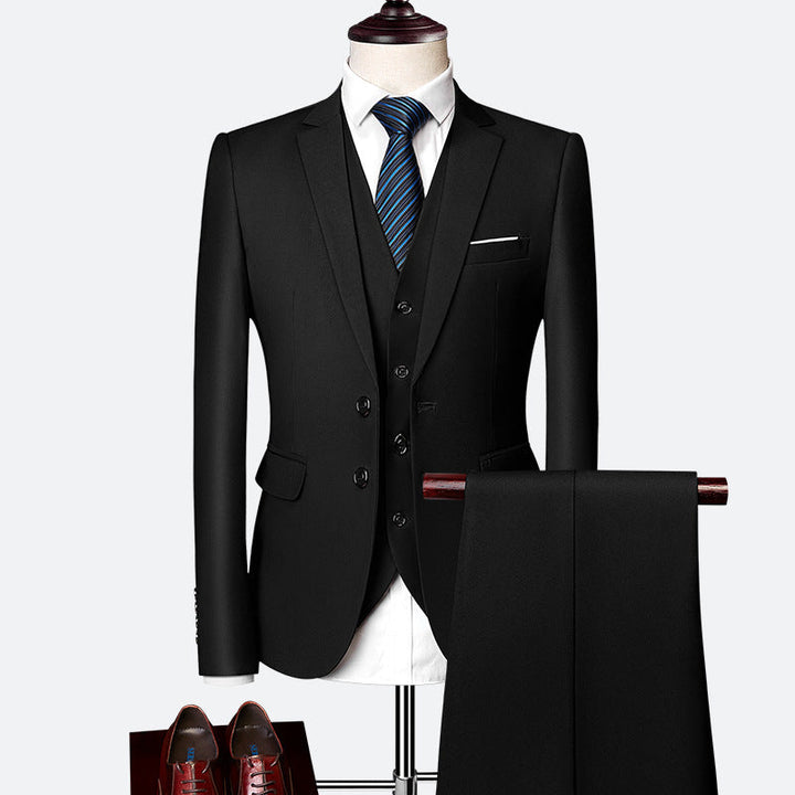 Classic slim-fit men's three-piece suit with vest and jacket, ideal tailored formal wear for groom or business attire.