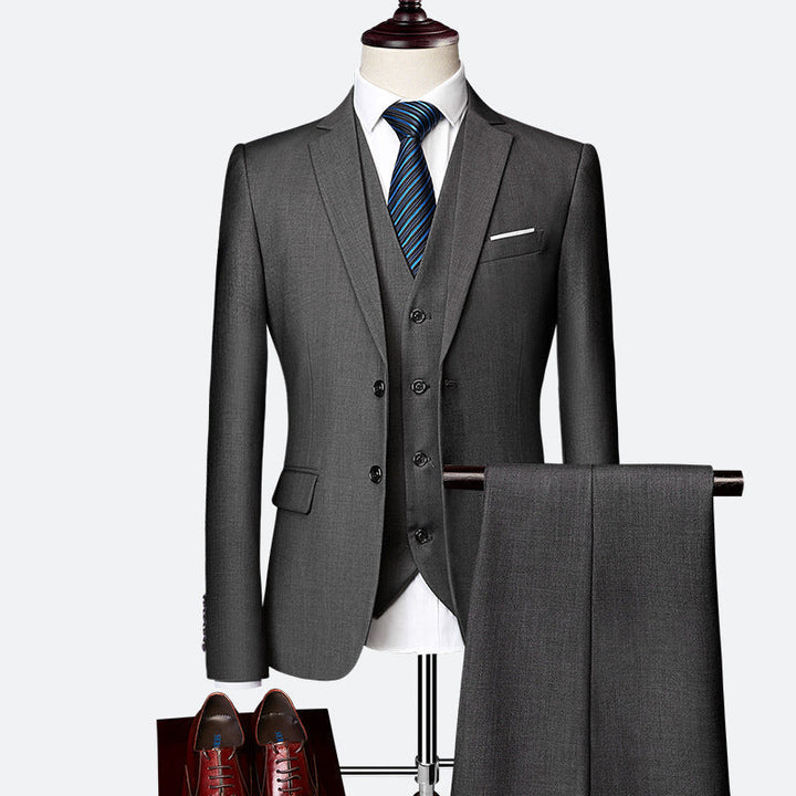 Elegant men's three-piece suit jacket & trousers. Tailored formal menswear for weddings, galas, and professional events.