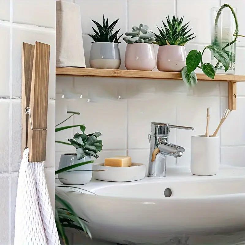Modern solid wood towel clamp, elegant and oversized, enhancing bathroom and home decor.