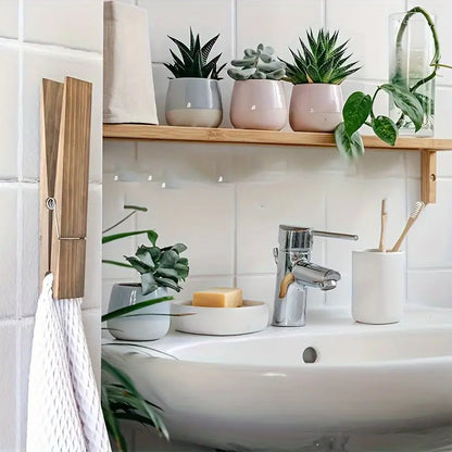 Modern solid wood towel clamp, elegant and oversized, enhancing bathroom and home decor.