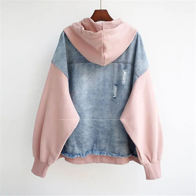 Modern white women's two-piece outfit with a fashionable hoodie and comfortable matching bottoms.