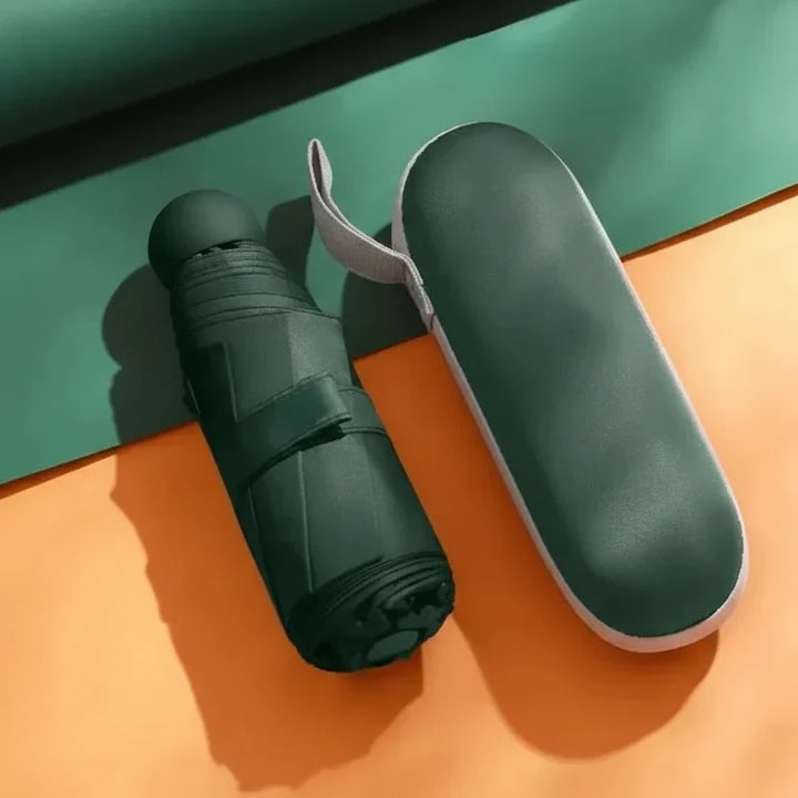 Pink portable travel umbrella, a stylish and compact daily essential for rain protection.