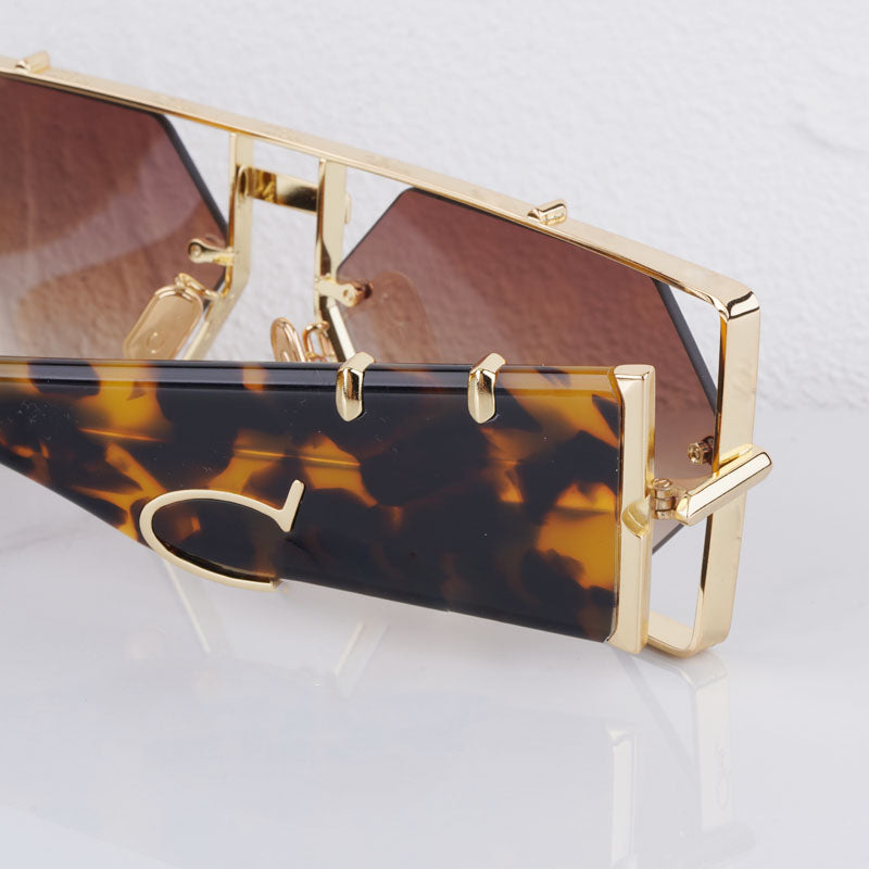 Unisex hexagon sunglasses featuring sleek tea lenses & UV400 protection. Modern fashion eyewear for all.