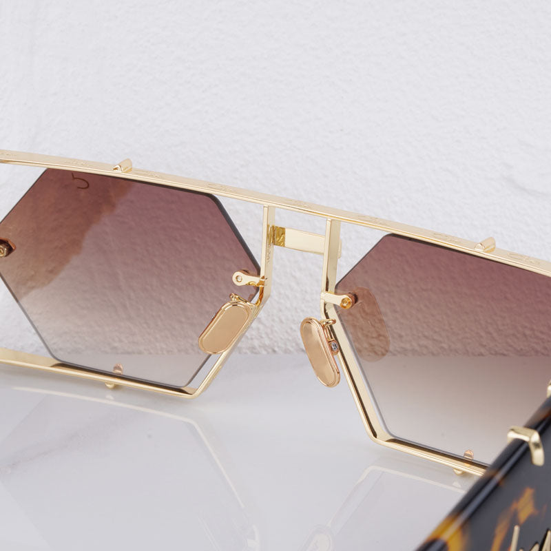 Bold purple hexagon sunglasses with UV400 protection. Trendy unisex eyewear for a striking fashion statement.