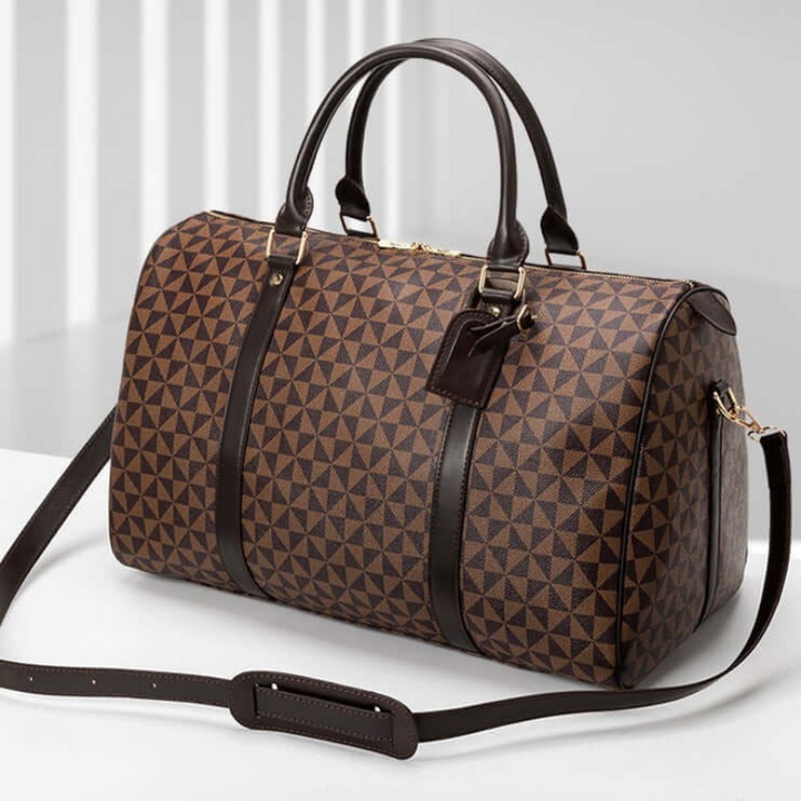 Brown premium duffle bag for travel, a stylish unisex carry-on or weekend bag. Versatile & durable.