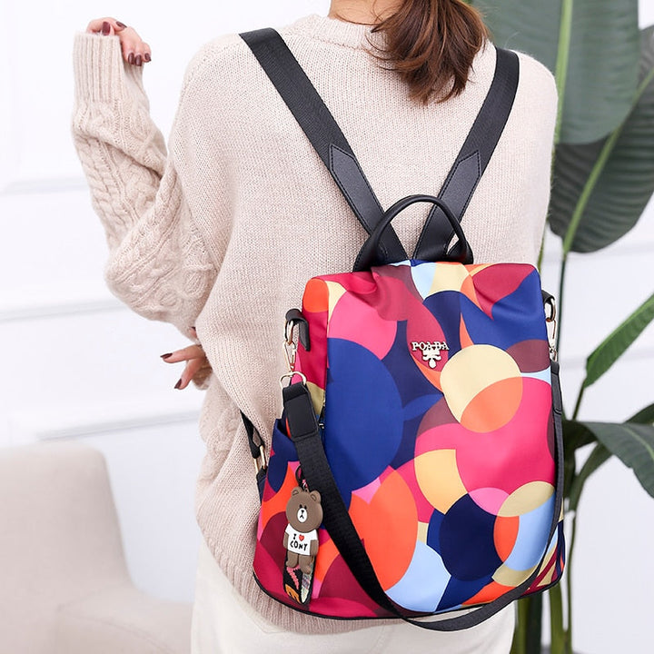 Stylish women's anti-theft backpack in PU leather, water-resistant with secure multi-pocket design for daily travel.
