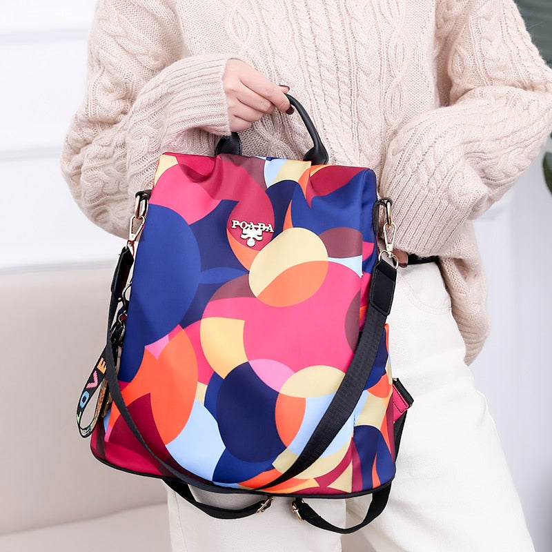 Back view of a secure anti-theft women's backpack, water-resistant with hidden zipper for ultimate safety.