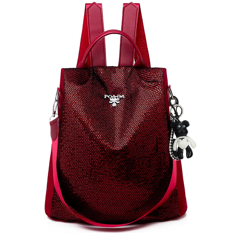 Detail of water-resistant oxford fabric on a secure women's anti-theft travel daypack.