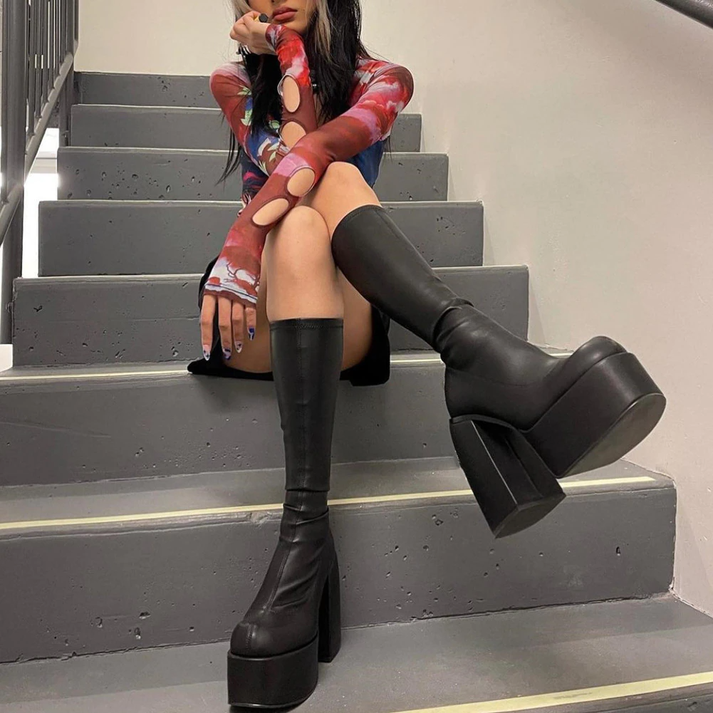 Chic black heeled ankle boots for women, elevating any outfit. Essential stylish footwear for edgy fashion.