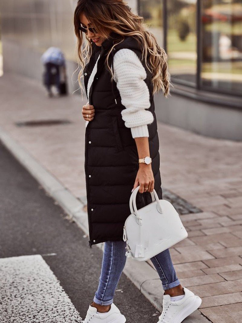 Stylish women's black quilted long vest, perfect for warm fall & winter layering as casual outerwear.