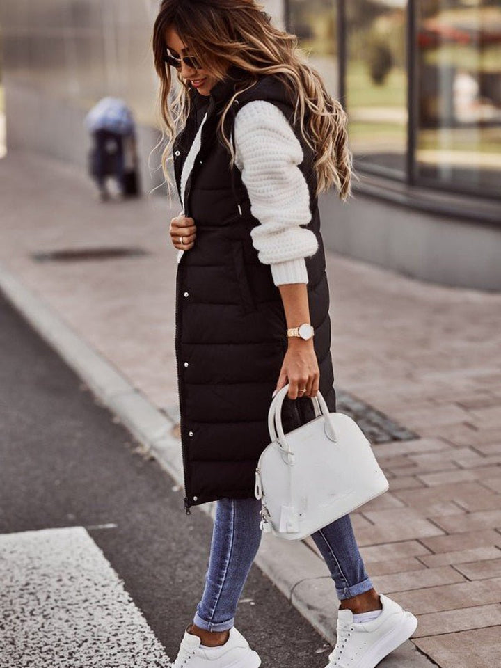 Stylish women's black quilted long vest, perfect for warm fall & winter layering as casual outerwear.