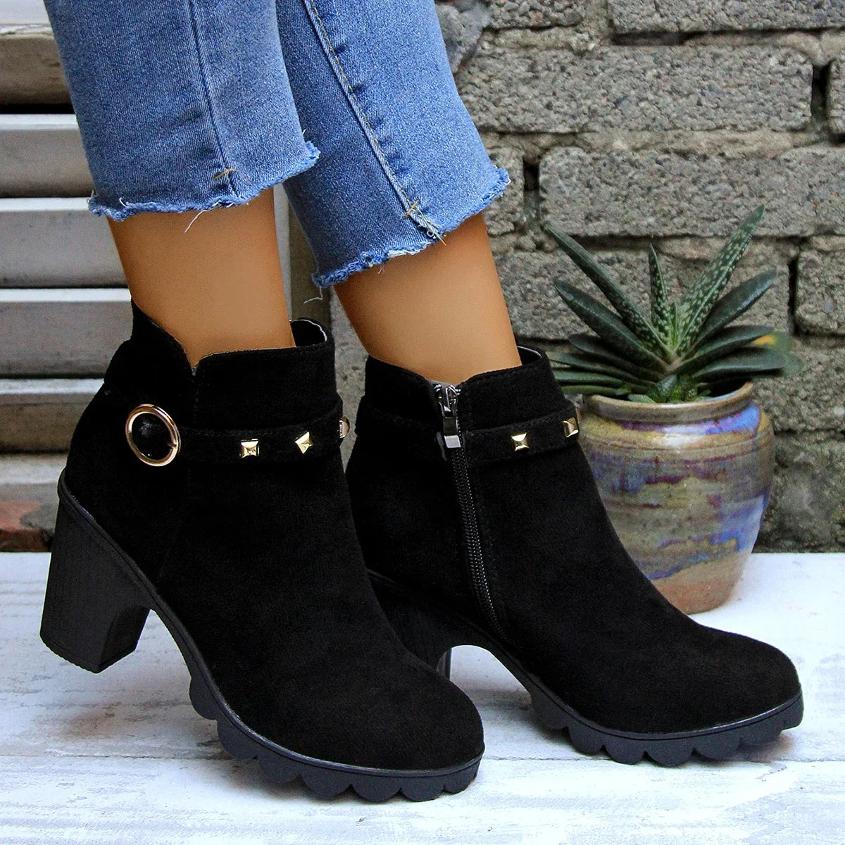 Women's fashionable studded boots with a sturdy block heel, perfect for autumn and winter comfort.