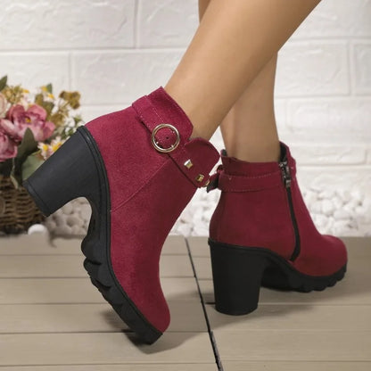 Modern women's studded ankle boots with a robust block heel, merging fashion and durability.
