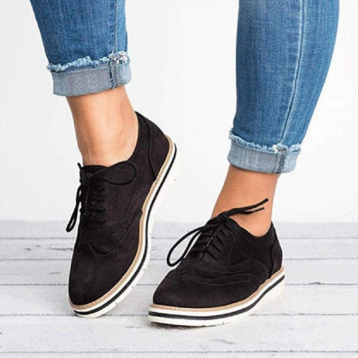 Chic women's lace-up brogue oxford sneakers, ideal for stylish casual outfits and comfortable walking.