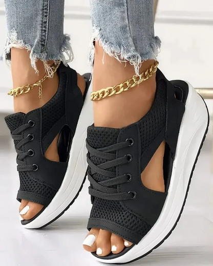 Comfortable women's muffin platform sandals, featuring stylish cutout design & lace-up for casual summer.