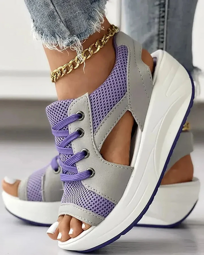 Trendy women's platform sandals with contrast cutout details, lace-up design, ideal for summer outfits.