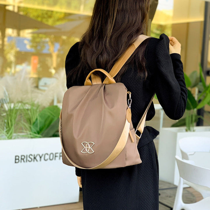Chic anti-theft women's fashion backpack. Secure travel bag converts to a stylish shoulder purse for daily use.