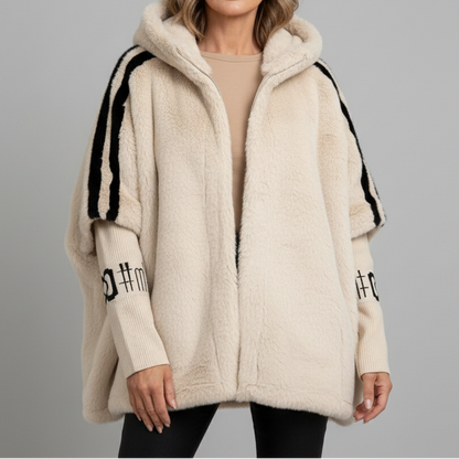 Elegant women's hooded winter parka jacket in a neutral color, offering a relaxed fit and cozy warmth for cold weather.