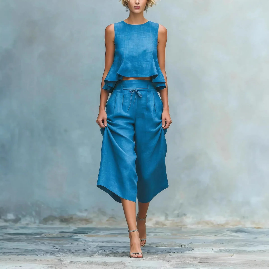 Stylish women's crop top & wide leg pant two-piece set. Chic casual matching summer outfit, comfortable travel wear.