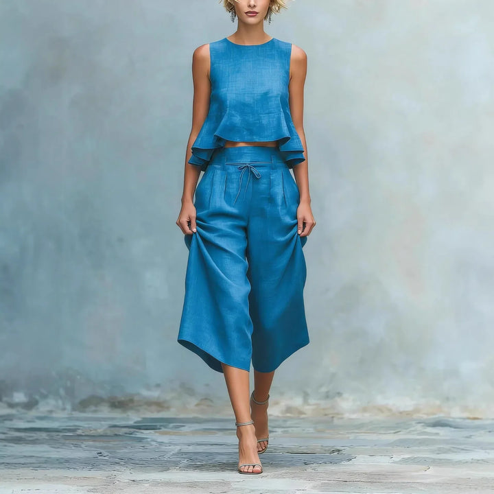 Stylish women's crop top & wide leg pant two-piece set. Chic casual matching summer outfit, comfortable travel wear.