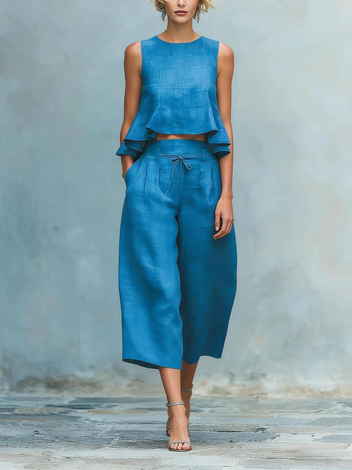 Chic women's two-piece crop top and wide leg pant set. Versatile summer outfit, perfect for casual wear or travel.