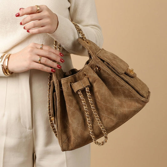Stylish women's genuine leather bucket shoulder bag in classic design, perfect for everyday use.