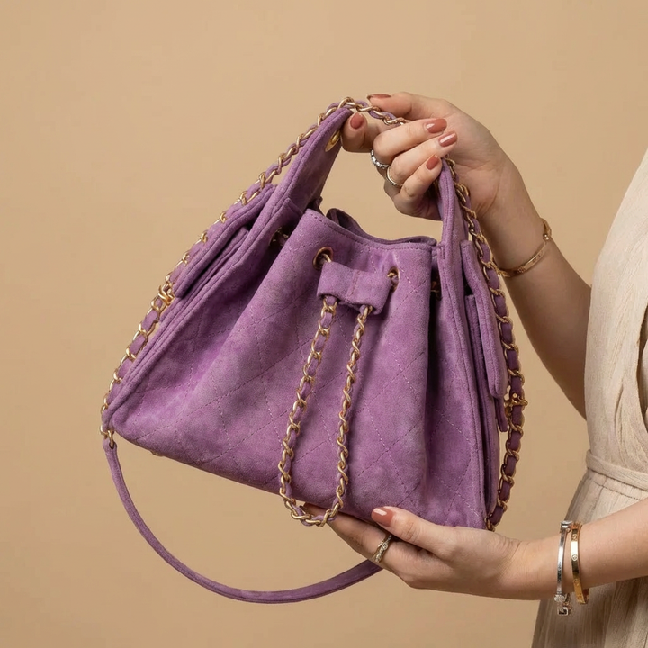 Premium genuine leather women's shoulder bag, a chic bucket style handbag with ample space and durable finish.