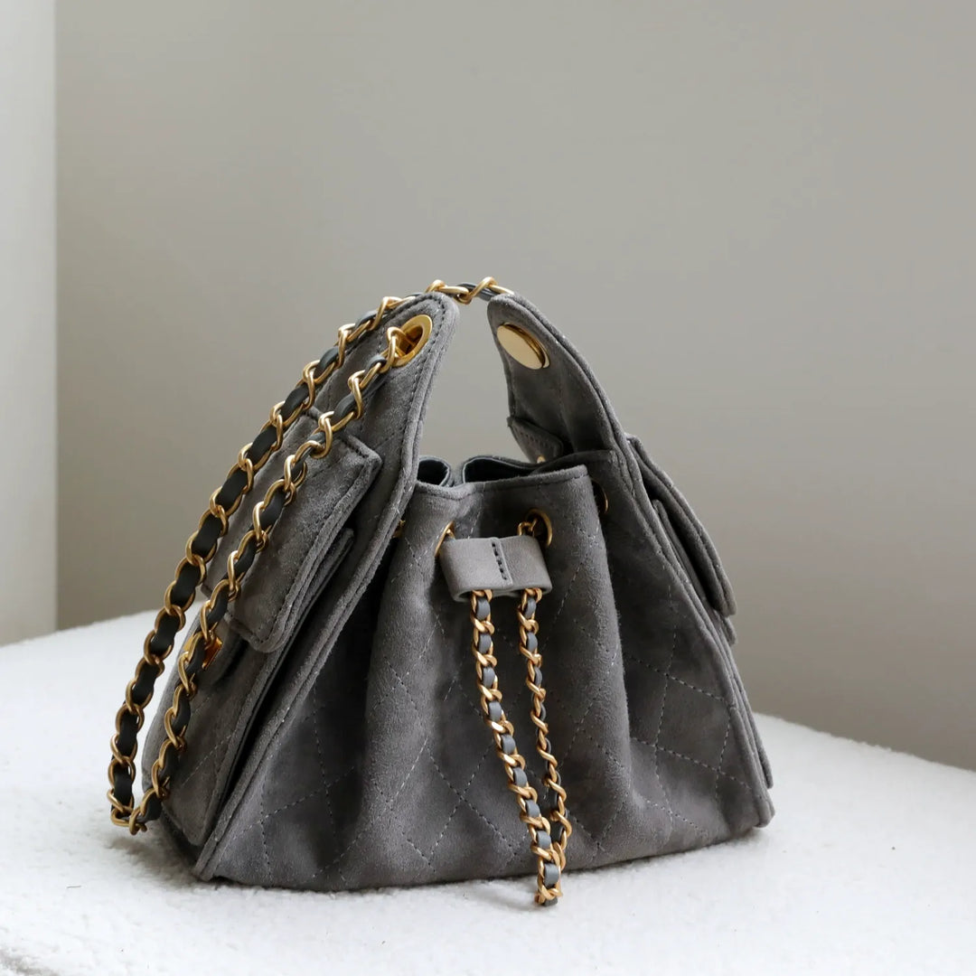 Sophisticated genuine leather women's bucket bag, a sturdy and stylish shoulder handbag for any occasion.