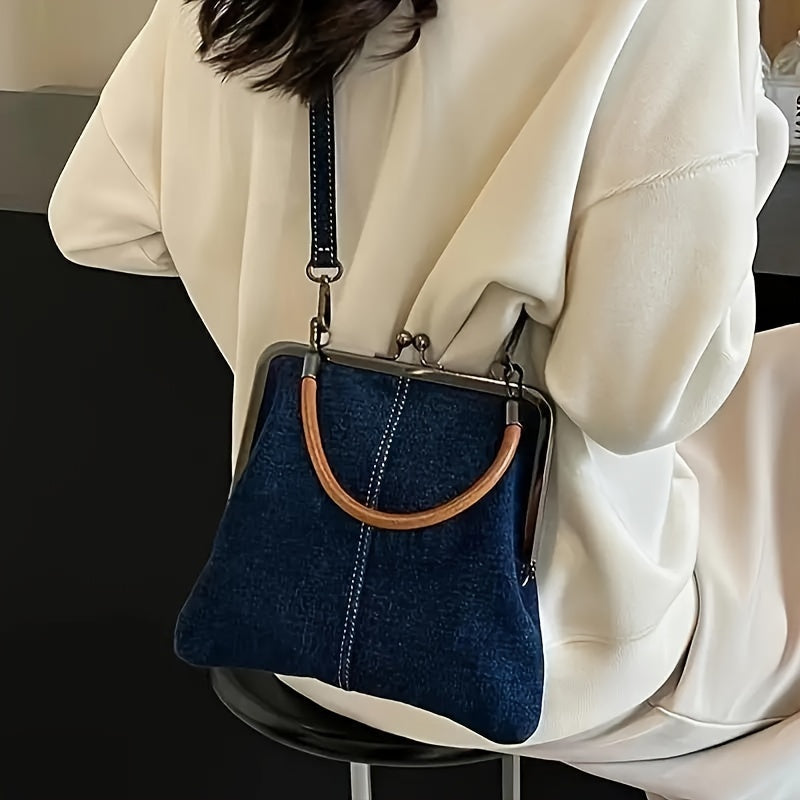 Light wash denim women's shoulder bag with leather accents, a trendy casual handbag for fashion lovers.