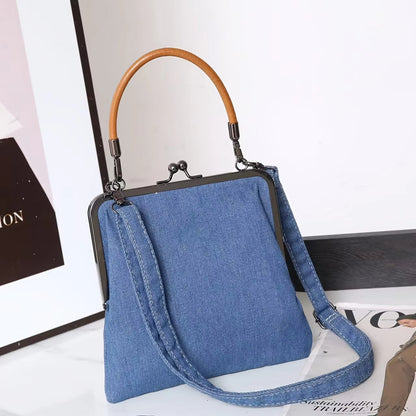 Fashion-forward women's denim bag with leather details, an elegant shoulder handbag for casual outfits.
