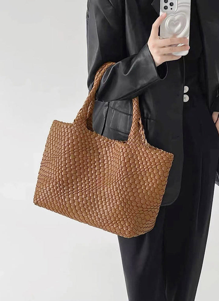 Chic women's large woven tote bag. Faux leather shoulder carryall, a fashionable daily handbag accessory.