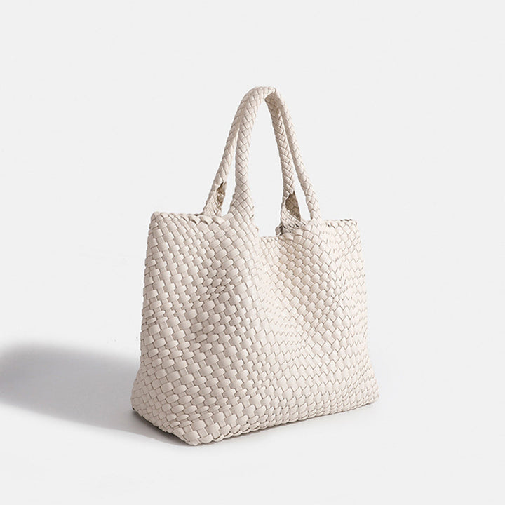 Versatile women's large woven tote bag. Fashionable faux leather shoulder carryall for daily tasks.