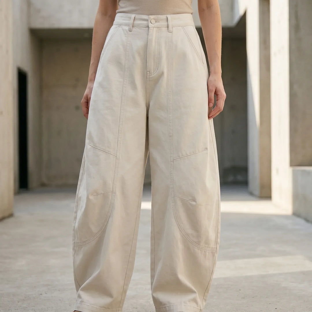 Stylish women's low-rise barrel-leg jeans, a loose-fit design for comfortable, vintage streetwear fashion. Everyday wear.