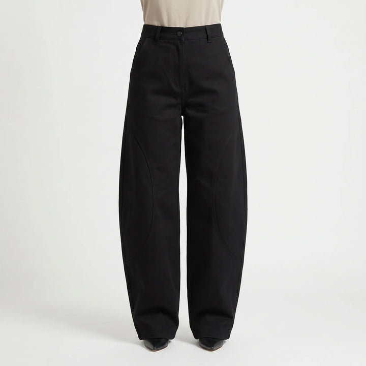 Women's low-rise barrel-leg jeans, offering a loose, comfortable fit and unique silhouette for modern streetwear.