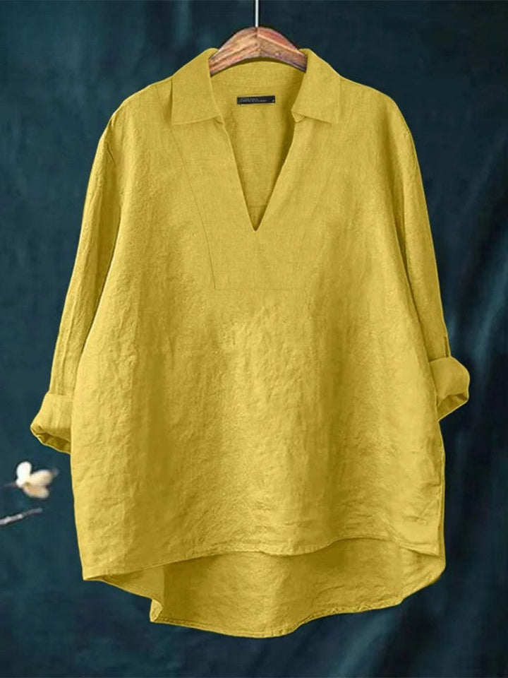 Relaxed fit women's V-neck blouse, comfortable & flowy, perfect for casual outings or chic business casual fashion.