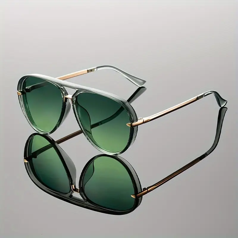 Elegant women's oversized aviator sunglasses, sleek metal frame providing ultimate sun protection.